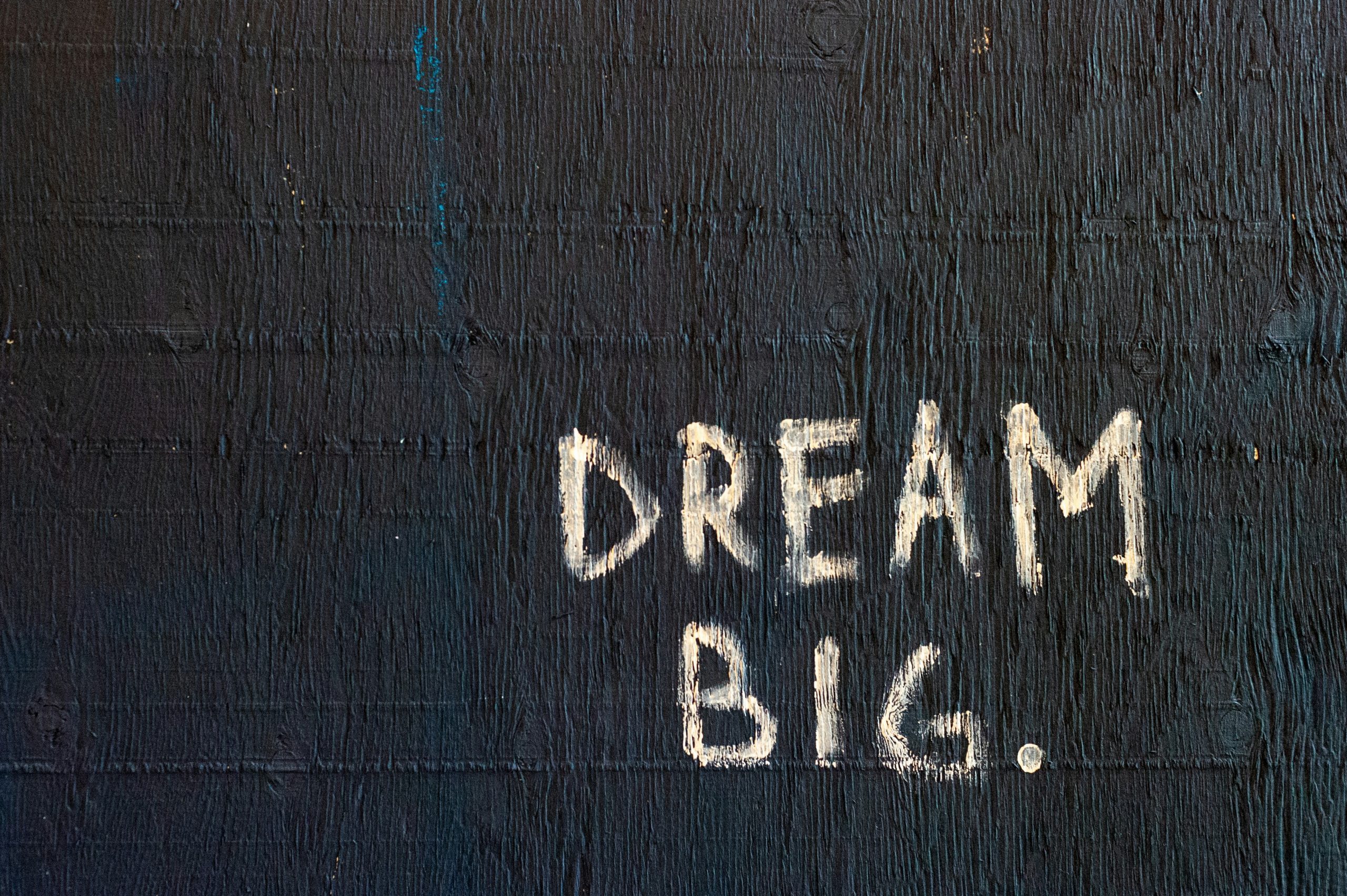 "Dream Big" all in capitals, white letters on a black background